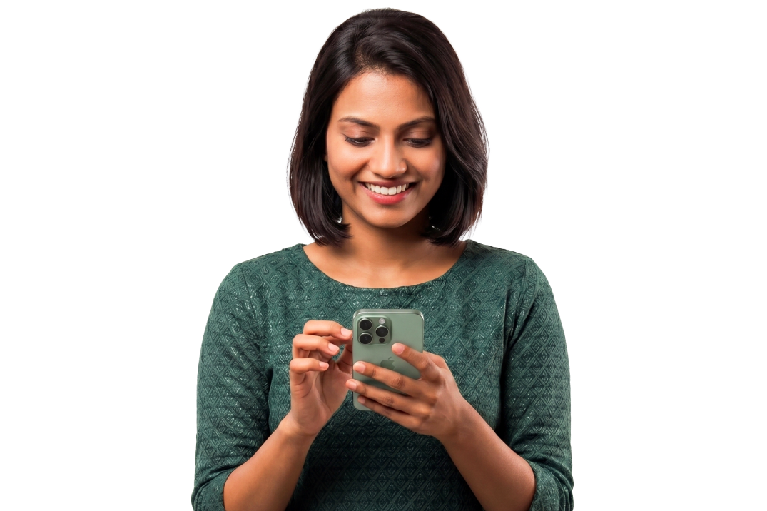 A young woman smiling while looking at the HomePe app on her phone